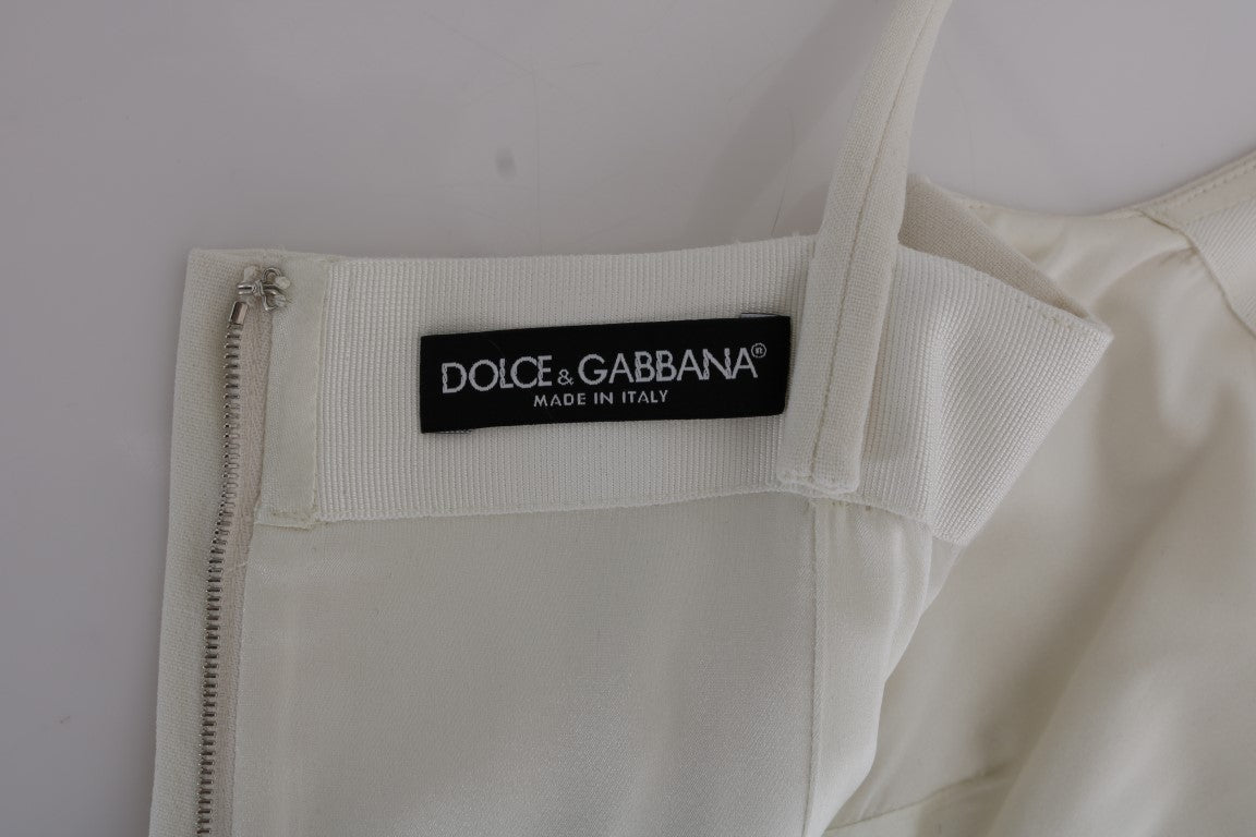 Елегантна біла вовняна сукня Dolce &amp; Gabbana із золотою брошкою