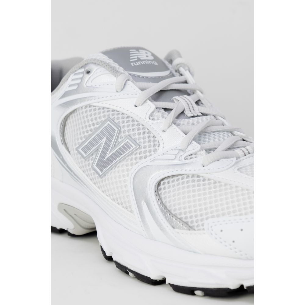 Сірі кросівки New Balance із синтетичної шкіри